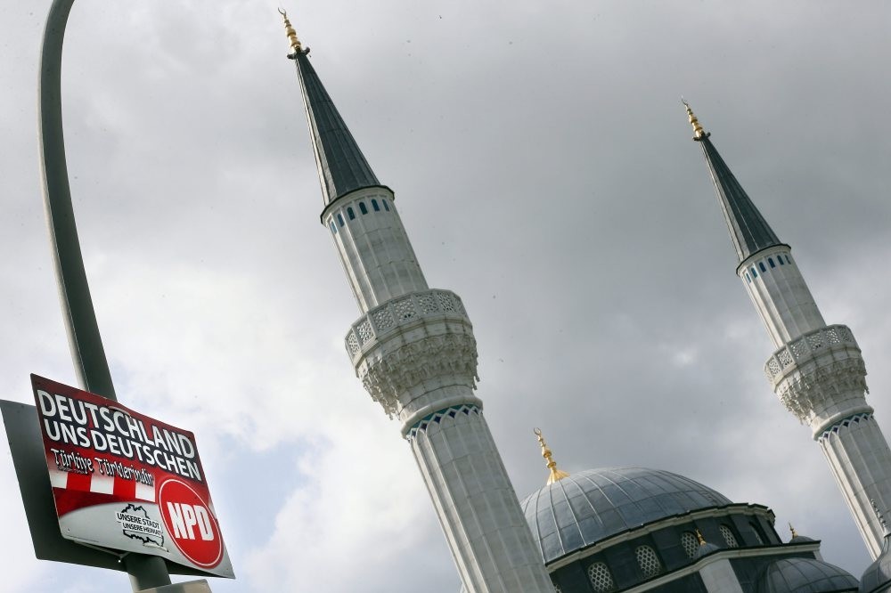 A placard of the German far-right NPD, is attached to a lamppost in front of the u015eehitlik Mosque in Berlin run by the Du0130Tu0130B. The slogan reads: u2018Germany (to) us Germansu2019 and adding in Turkish the slogan u2018Turkey to the Turksu2019.