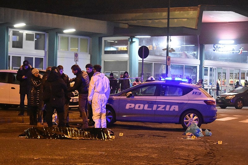 Italian Police officers work next to the body of Anis Amri, the suspect in the Berlin Christmas market truck attack, in a suburb of the northern Italian city of Milan, Italy Dec. 23, 2016. (Reuters Photo)