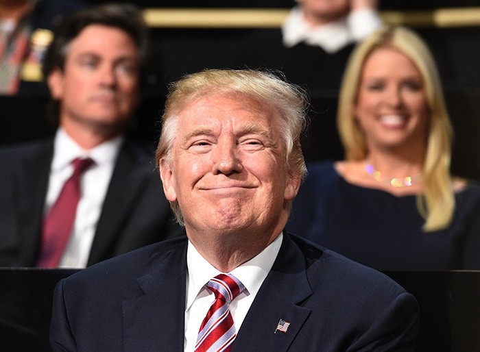 Republican presidential candidate Donald Trump smiles on day three of the Republican National Convention at the Quicken Loans Arena in Cleveland, Ohio on July 20, 2016. (AFP Photo)