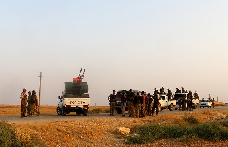 Free Syrian Army fighters are seen near the Syrian village of Zughrah, which recently captured from Daesh terrorists on Aug. 31. (AA Photo)