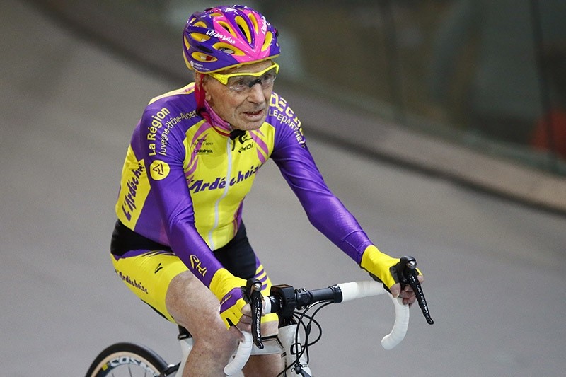 French cyclist Robert Marchand, aged 105, finishes after setting a record for distance cycled in one hour, at the velodrome of Saint-Quentin en Yvelines, outside Paris, Wednesday, Jan. 4, 2017. (AP Photo)