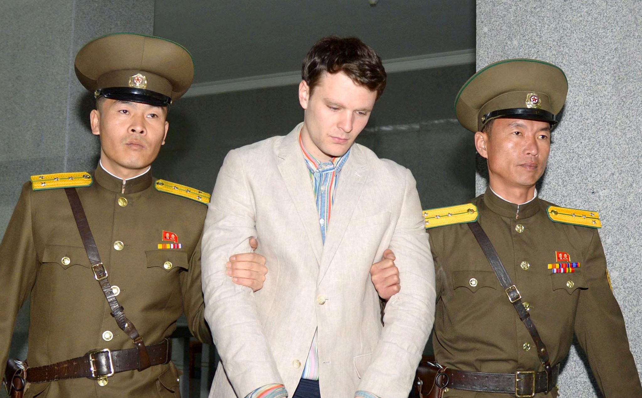 Otto Frederick Warmbier (C), a University of Virginia student who was detained in North Korea since early January, is taken to North Korea's top court in Pyongyang, North Korea, in this photo released by Kyodo March 16, 2016. (REUTERS Photo)