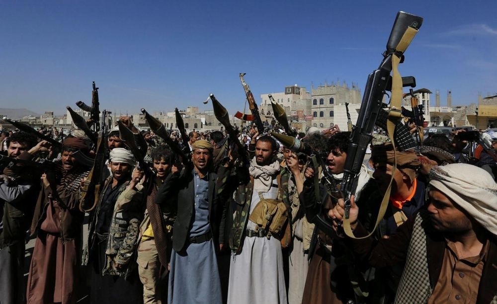 Houthi supporters hold weapons, aiming to mobilize more fighters, in Sana'a, Yemen, Nov. 24.