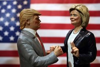 Statuettes depicting the presidential candidates Donald Trump, left, and Hillary Clinton are displayed in a shop in Via San Gregorio Armeno, the street of nativity scene craftsmen, in Naples. (AP Photo)
