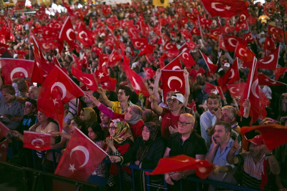 People waving their national flags as they shout slogans during a demonstration against the failed July 15 coup attempt, in Istanbul, July 20.