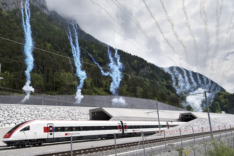 The first train comes out of the tunnel's North portal on the opening day of the Gotthard rail tunnel, at the North portal near Erstfeld, Switzerland, Wednesday, June 1, 2016. (AP Photo)
