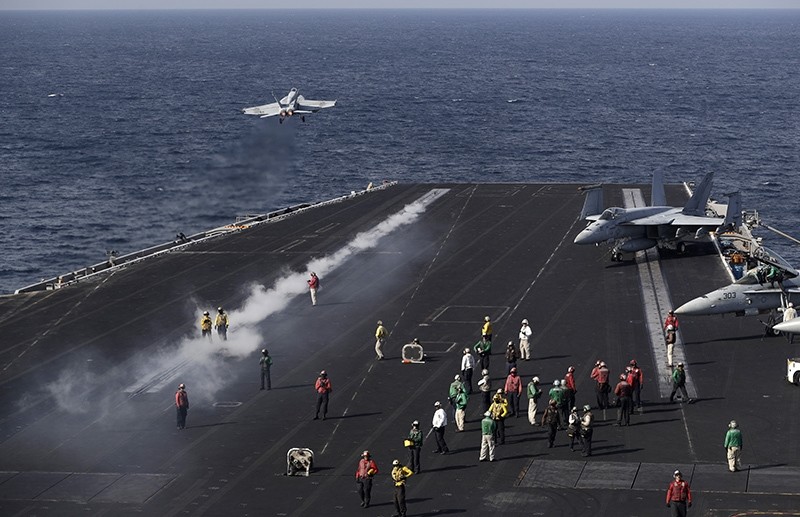  In this picture taken on Monday, Nov. 21, 2016, a U.S. Navy fighter jet takes off from the deck of the U.S.S. Dwight D. Eisenhower aircraft carrier (AP Photo)