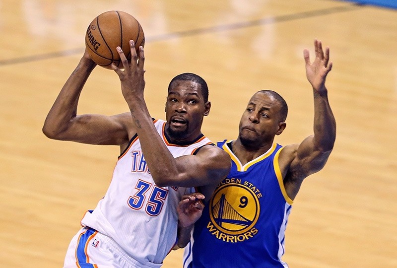 Former OKC Thunder forward Kevin Durant drives to the basket as Warriors forward Andre Iguodala (9) defends during Game 4 of the Western conference finals of the NBA Playoffs at Chesapeake Energy Arena, May 24, 2016; Oklahoma City (Reuters Photo)