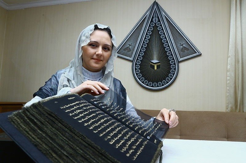 Painter and decorative artist Tu00fcnzale Memmedzade wrote Quranic verses on silk. Nov. 2016. (AA Photo)
