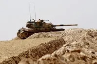 Turkish soldiers waiting their tanks as they prepare for a military operation on the Syrian border as part of their offensive against DAESH in Syria, the Karkamu0131u015f district of Turkey's southeastern Gaziantep province, Aug. 27.