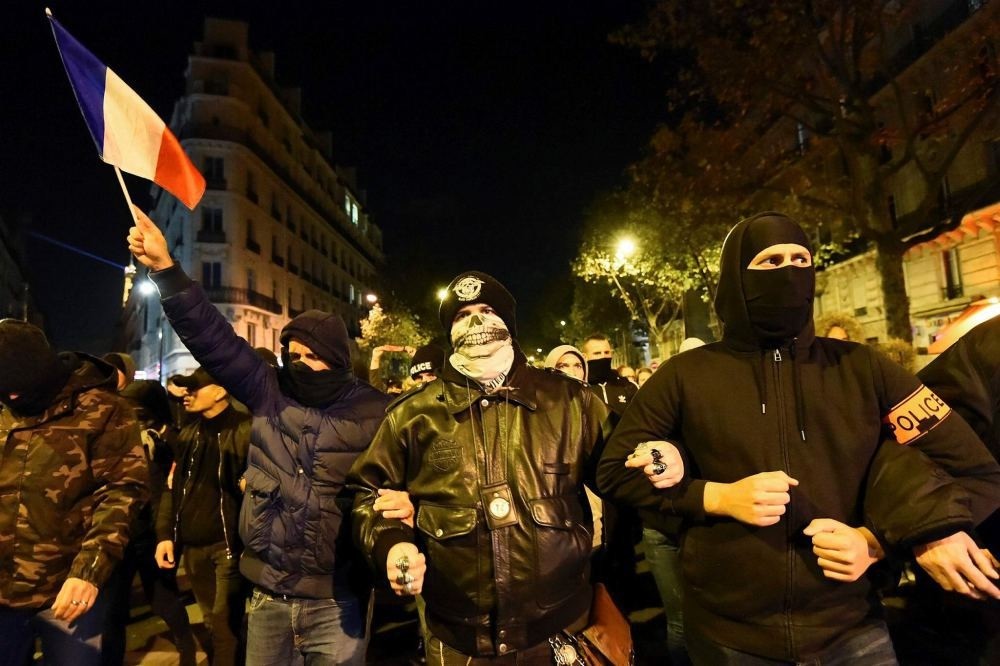 French police officers take part in a rally in Paris on Oct. 20 to protest over mounting attacks on officers.