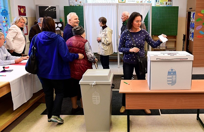 Voters are pictured at a polling station in Budapest, on October 2, 2016 (AFP Photo)