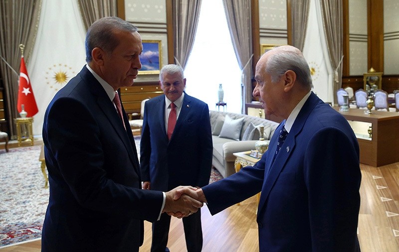  President Recep Tayyip Erdou011fan left, greets Devlet Bahu00e7eli before a meeting in Ankara, Turkey, Monday, July 25 (AP Photo)
