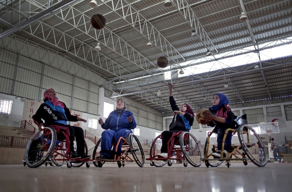Disabled Palestinian women take part in a basketball training session held by top U.S. coach Jess Markt in the Khan Younis refugee camp, southern Gaza Strip. 