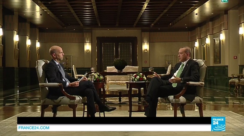 A screen caption from France 24's interview with President Recep Tayyip Erdou011fan.
