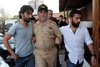 Adm. Nejat Demirhan detained on coup charges is also among detainees in plot case.