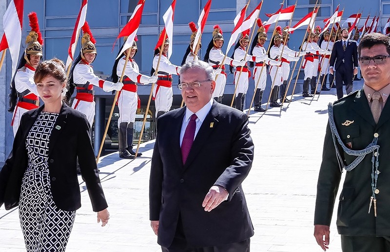 Handout undated picture released the Brazilian presidency showing Greek ambassador to Brazil, Kyriakos Amiridis (C), leaving after presenting his credentials to Brazilian President Michel Temer (AFP Photo)