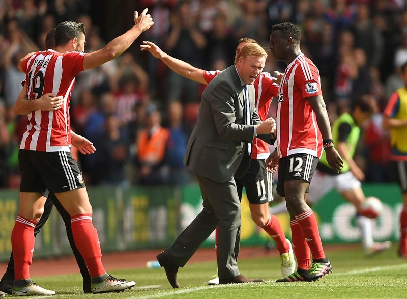 Ronald Koeman joins in the festivities during the English Premier League soccer match between Southampton FC and Crystal Palace at the St Maryu2019s stadium in Southampton , England. Sunday May 15, 2016 (AP Photo)