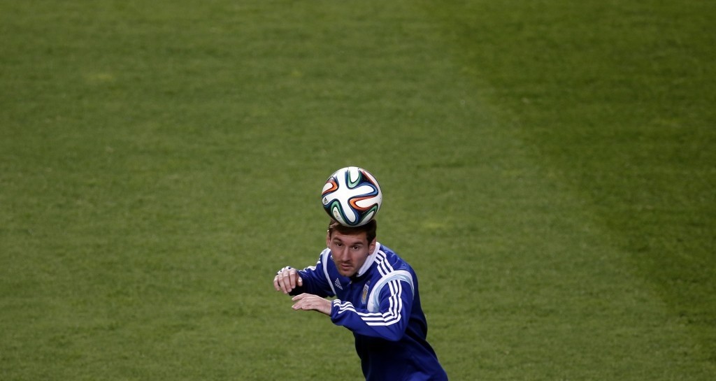 Argentina's Messi heads the ball during a training session in preparation for 2014 World Cup. (REUTERS Photo)