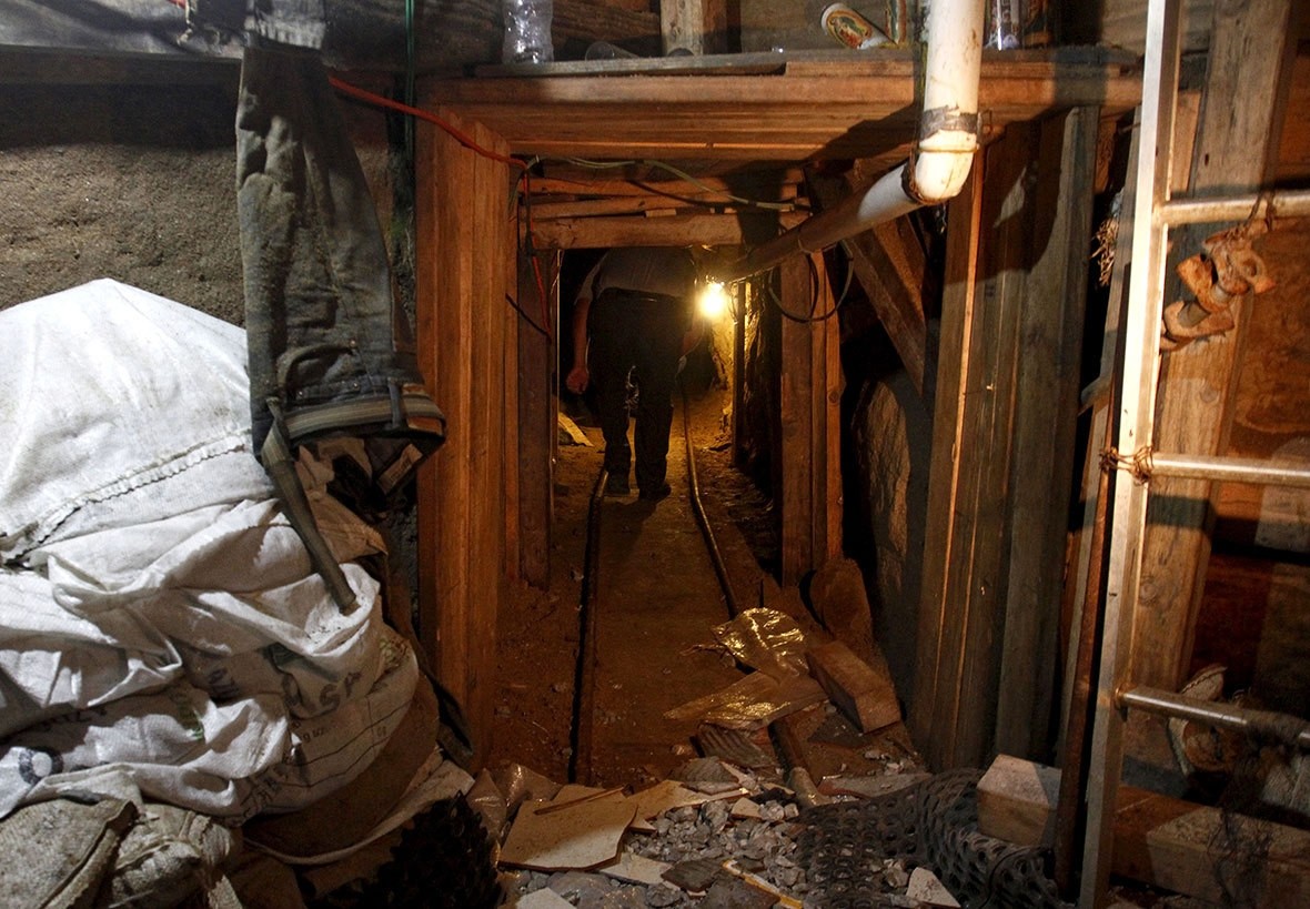 US Border Patrol agent inspects an underground tunnel found near the Morley Gate Border Station at the US-Mexico border in Nogales, Arizona. 