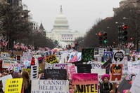 Protesters walk up Pennsylvania Avenue during the Womenu2019s March in Washington. 