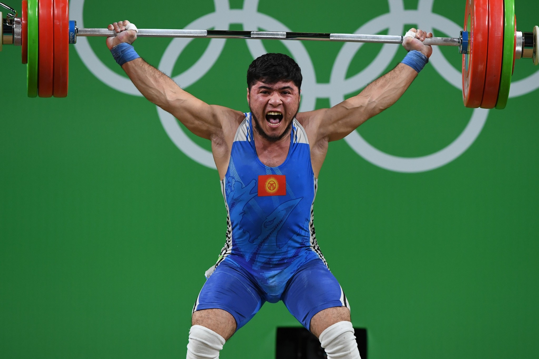 Picture taken on August 9,2016 shows Kirghyzstan's Izzat Artykov competing during the Men's 69kg weightlifting competition at the Rio 2016 Olympic Games in Rio de Janeiro on August 9, 2016. (AFP Photo)