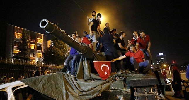  People stand on a Turkish army tank in Ankara, Turkey July 16, 2016. (Reuters Photo) 