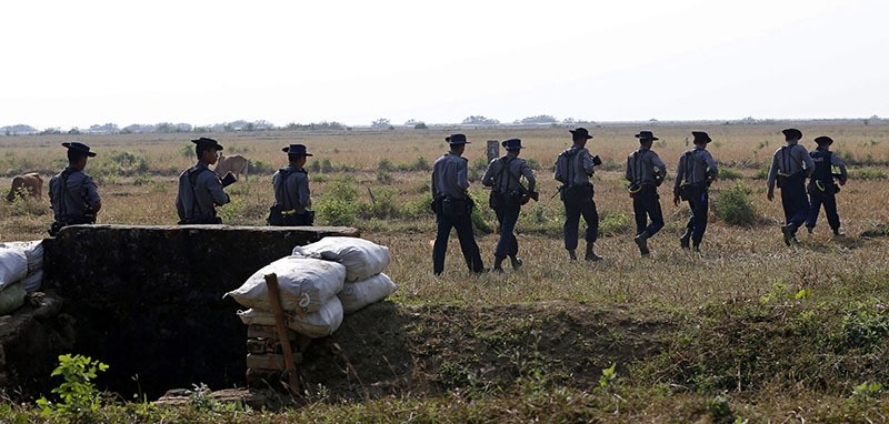 Myanmar police patrol near KoeTanKauk Border Guard Police post around the villages near the Maungdaw town of Bangladesh-Myanmar border, Rakhine State, western Myanmar, 22 December 2016. (EPA Photo)
