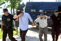 Two of eight Turkish soldiers who fled to Greece in helicopter and requested political asylum after a failed military coup, are brought to prosecutor in Alexandroupolis, Greece July 17, 2016.  REUTERS Photo