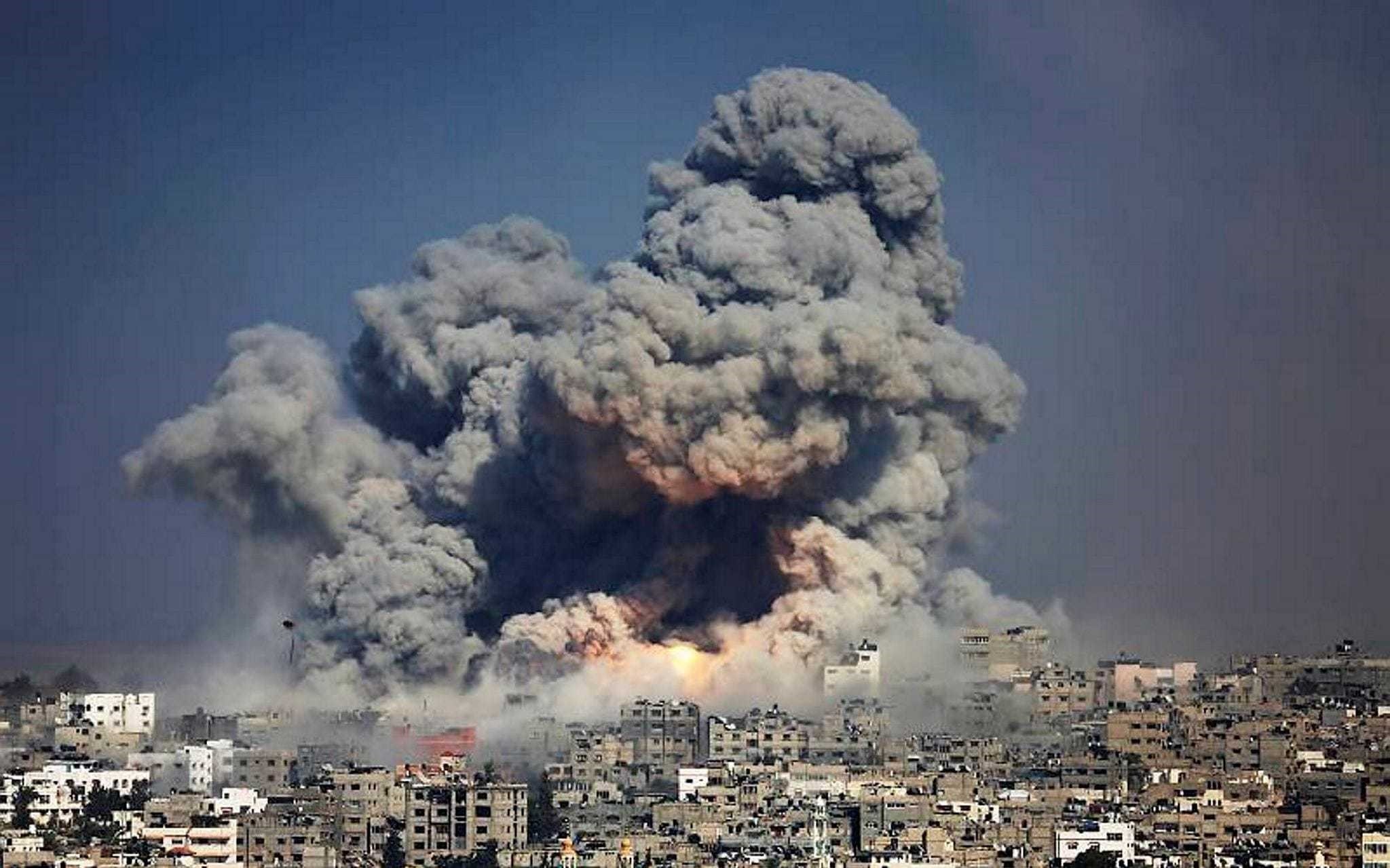 Smoke and fire from an Israeli strike rose over Gaza City on July 29, 2014.