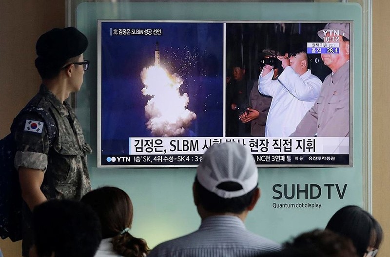  In this Thursday, Aug. 25, 2016, file photo, a South Korean army soldier watches a TV news program showing images published in North Korea's Rodong Sinmun newspaper (AP Photo)