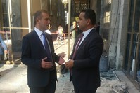 Kandemir (L) spoke to Ali u00dcnal from Daily Sabah in one of the demolished parts of the Parliament due to airstrike in the coup attempt on Friday.