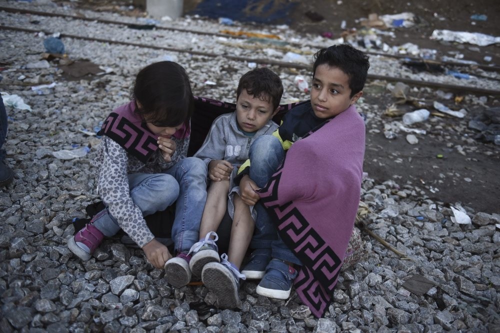 Syrian children as they wait to cross the border from the northern Greek village of Idomeni to southern Macedonia in September 2015.