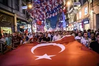 Turkish football supporters taking part in a rally against the failed coup attempt in Taksim Square, Istanbul on July 23. 