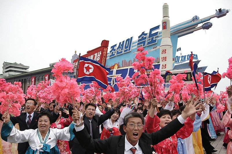 In this May 10, 2016, file photo, parade participants march with a model of the Unha space launch vehicle at the Kim Il Sung Square on Tuesday, May 10, 2016, in Pyongyang, North Korea. (AP Photo)