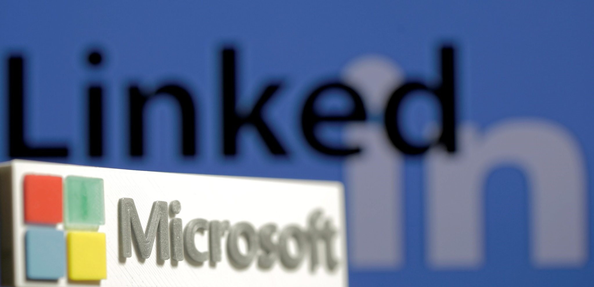 A 3D printed logo of Microsoft is seen in front of a displayed LinkedIn logo in this illustration taken June 13, 2016. (REUTERS Photo)