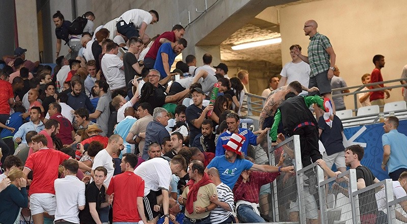 Supporters clash in the stands after the UEFA EURO 2016 group B preliminary round match between England and Russia at Stade Velodrome in Marseille, France, 11 June 2016. (EPA Photo)