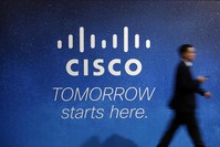 A visitor walks past a Cisco advertising panel at the Mobile World Congress in Barcelona February 27, 2014. (REUTERS Photo)