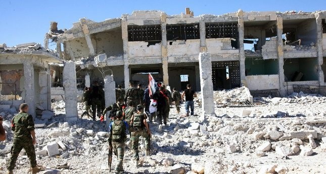 A handout photo released on 25 September 2016 by the official Syrian Arab News Agency (SANA) showing Syrian soldiers at Handarat camp in the north of Aleppo, Syria, 24 September 2016. (EPA Photo)
