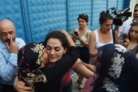 u00c7ilem Dou011fan (C-L) hugs her relatives outside the court, June 20, 2016 (IHA Photo)