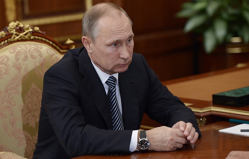 Russian President Vladimir Putin listens during a meeting with VTB CEP Andrei Kostin in Moscow's Kremlin on Tuesday, Sept. 27, 2016 (AP Photo)