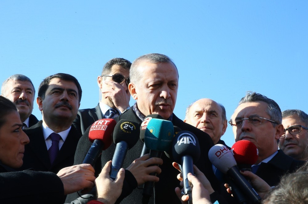President Recep Tayyip Erdou011fan answers the questions of journalists on Friday.