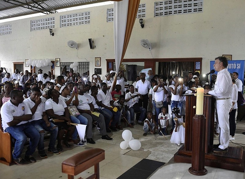 Colombian President J. M. Santos speaks during a mass in Bojayu00e1, Chocu00f3, one of the towns that has suffered most in the armed conflict in Colombia, announcing heu2019ll donate Nobel Prize money to victims, Oct. 9, 2016. (EPA Photo)