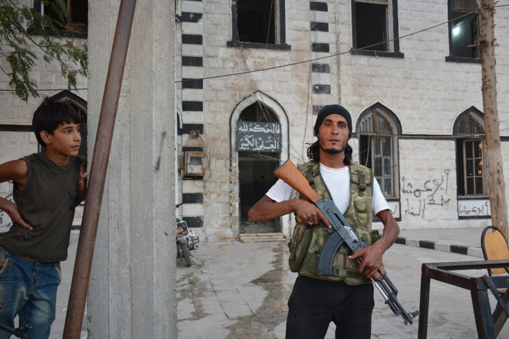 A Free Syrian Army fighter poses in the main square of the northern Syrian town of Jarablus.