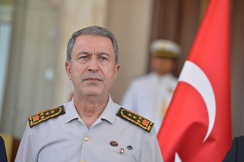 Chief of Staff Akar, with clear bruises on his neck resulted from scuffles with coup plotting soldiers, is seen on July 17 in Ankara during his first appearance following the coup attempt. (Photo: Sabah / Ali Ekeyu0131lmaz)