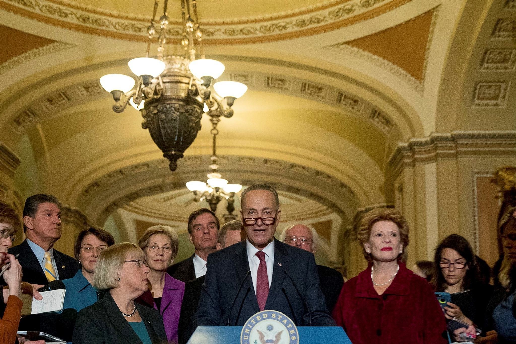 Sen. Chuck Schumer, D-N.Y., center, accompanied by the Senate Democrats, speaks to reporters on Capitol Hill in Washington, Wednesday, Nov. 16, 2016. (AP Photo)