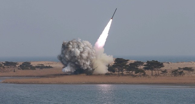 An undated handout file photograph made available on 04 March 2016 by the North Korean news agency KCNA shows the test-firing of new-type large-caliber multiple launch rocket system by the North Korean military (EPA Photo)