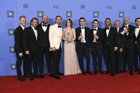 The cast and crew of ,La La Land, poses in the press room with the award for best motion picture - musical or comedy at the 74th annual Golden Globe Awards (AP Photo)