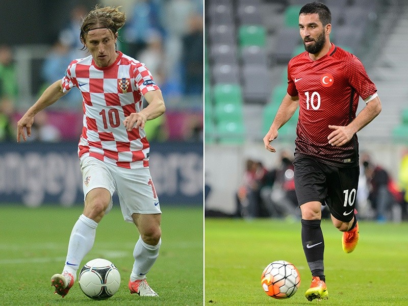 A combination of two file pictures shows Croatia's midfielder Luka Modric (L) in Poznan on June 14, 2012 and Turkey's midfielder Arda Turan in Ljubljana on June 5, 2016. (AFP Photo)