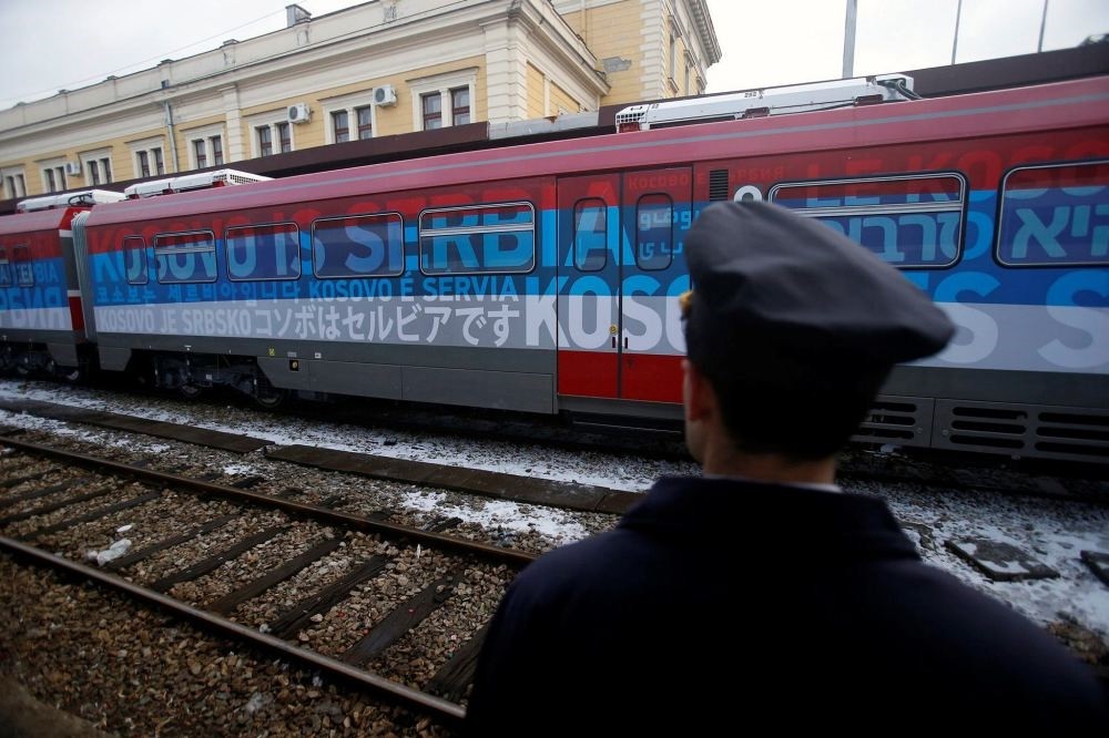 A railroad worker stands by the first train decorated with letters that read u201cKosovo is Serbianu201d written in twenty languages departing from the Belgrade to Mitrovica, Kosovo at Belgradeu2019s railway station, Serbia, Jan. 14.